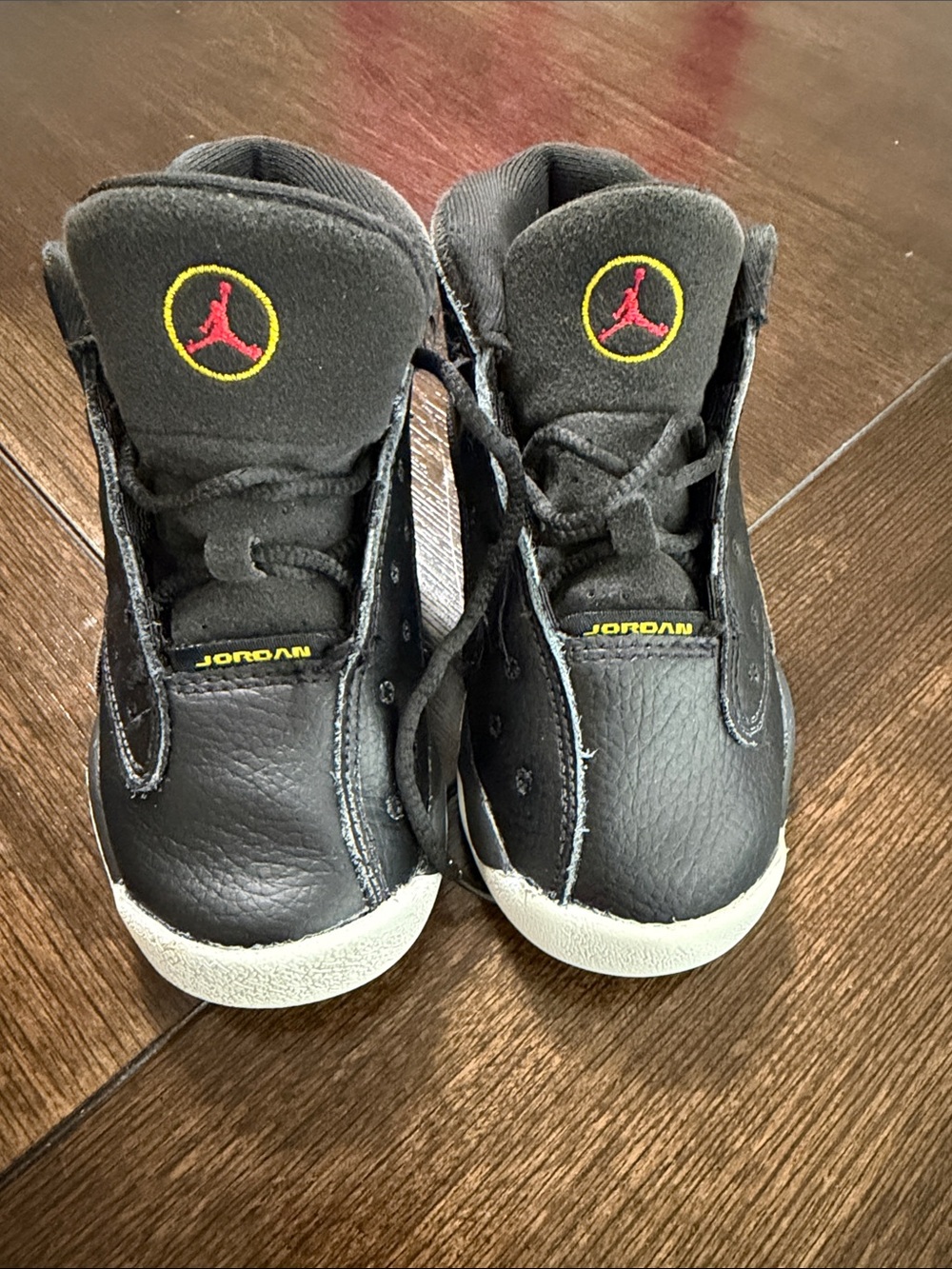 Jordan Kids Black Sneakers with Red and Yellow Jumpman Accents